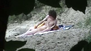 Hidden cam camera capturing couple on beach having fuck-fest in public