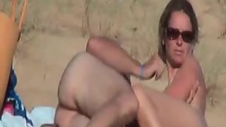 Mature nudist couple getting all down and filthy at the beach