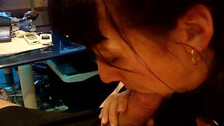 Brunette giving a very sultry pov blowjob to her hubby on the couch